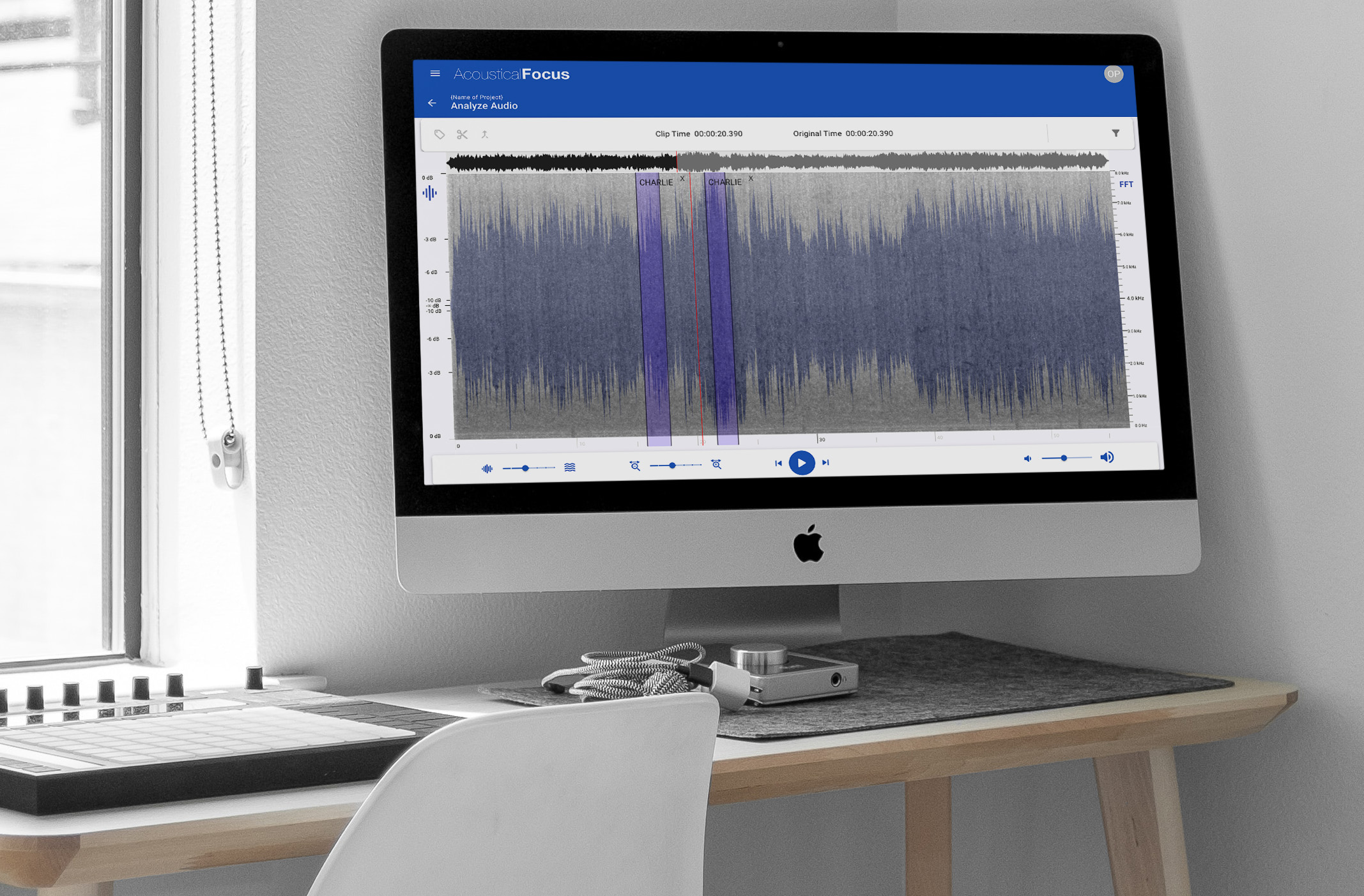 Acoustical Focus application running on an iMac with audio input devices on the table next to it.